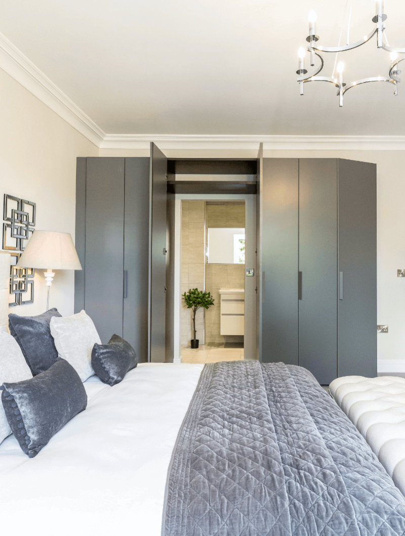 Alderbrook Road project Modern bedroom with ensuite hidden behind wardrobes